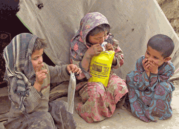 Afghani children with aid packages
